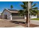 Angle side view of a single-story home featuring a two-car garage and solar panels at 1906 N Evergreen St, Chandler, AZ 85225