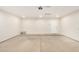 Spacious two car garage with concrete floor and bright lighting at 1906 N Evergreen St, Chandler, AZ 85225