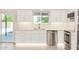 Bright and modern kitchen with stainless steel appliances and white cabinets at 1906 N Evergreen St, Chandler, AZ 85225