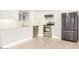 Bright and modern kitchen with stainless steel appliances and white cabinets at 1906 N Evergreen St, Chandler, AZ 85225
