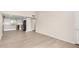 Open-concept living room and kitchen with lots of natural light and modern flooring at 1906 N Evergreen St, Chandler, AZ 85225