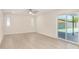 Spacious and bright living room with a sliding glass door to an outdoor space at 1906 N Evergreen St, Chandler, AZ 85225