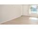 Bright living room with modern floors, natural light, and front door at 1906 N Evergreen St, Chandler, AZ 85225