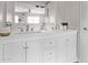 This bathroom features a double vanity with plenty of space and storage, with modern fixtures and a neutral color palette at 1914 S Brooks Cir, Mesa, AZ 85202