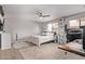 Cozy bedroom with a ceiling fan, warm-toned decor, and a comfortable bed, creating a relaxing atmosphere at 1914 S Brooks Cir, Mesa, AZ 85202
