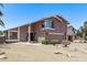 Two-story home featuring a well-maintained front yard and a two-car garage at 1914 S Brooks Cir, Mesa, AZ 85202