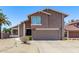 Charming two-story home featuring desert landscaping, a two-car garage and freshly painted facade at 1914 S Brooks Cir, Mesa, AZ 85202
