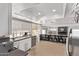 Open concept kitchen featuring views of a breakfast bar, backyard, and a sliding glass door at 1914 S Brooks Cir, Mesa, AZ 85202
