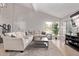 Bright living room features high ceilings, tile floors, large windows and a cozy sofa at 1914 S Brooks Cir, Mesa, AZ 85202