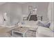 Spacious living room featuring high ceilings, tile floors, staircase and cozy sofa at 1914 S Brooks Cir, Mesa, AZ 85202