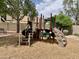 Community playground featuring a slide, stairs, and a play structure for outdoor fun at 1914 S Brooks Cir, Mesa, AZ 85202