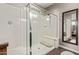 Bathroom featuring a large walk-in shower with a glass enclosure and a shower seat at 2023 W Yellowbird Ln, Phoenix, AZ 85085