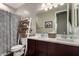Bathroom featuring a double sink vanity, decorative ladder shelving, and neutral wall paint at 2023 W Yellowbird Ln, Phoenix, AZ 85085