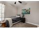 Stylish bedroom with a twin bed, world map art, and ample natural light at 2023 W Yellowbird Ln, Phoenix, AZ 85085