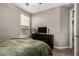 Comfortable bedroom with a queen size bed and neutral tones at 2023 W Yellowbird Ln, Phoenix, AZ 85085
