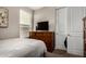 Bedroom with a dresser and a television at 2023 W Yellowbird Ln, Phoenix, AZ 85085