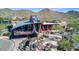 Unique, modern clubhouse architecture with desert landscaping, water features, and mountain views at 2023 W Yellowbird Ln, Phoenix, AZ 85085
