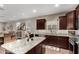 Kitchen featuring granite countertops, stainless steel appliances, and an island with seating at 2023 W Yellowbird Ln, Phoenix, AZ 85085