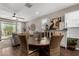 Open-concept living and dining area filled with natural light and featuring stylish furniture at 2023 W Yellowbird Ln, Phoenix, AZ 85085