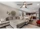 Spacious living area showcasing a comfortable sectional sofa, stylish decor, and seamless kitchen access at 2023 W Yellowbird Ln, Phoenix, AZ 85085