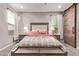 This main bedroom features carpet, a sliding wood door, and natural light from two different windows at 2023 W Yellowbird Ln, Phoenix, AZ 85085