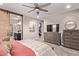 The main bedroom has carpet, a ceiling fan, ensuite bathroom and walk in closet at 2023 W Yellowbird Ln, Phoenix, AZ 85085