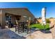 Lovely backyard patio area with artificial grass, perfect for outdoor gatherings and relaxation at 2023 W Yellowbird Ln, Phoenix, AZ 85085