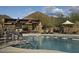 Beautiful lap pool with desert views, cabana with outdoor seating, and desert landscaping at 2023 W Yellowbird Ln, Phoenix, AZ 85085