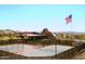 Community tennis courts overlooking the clubhouse and desert landscape at 2023 W Yellowbird Ln, Phoenix, AZ 85085