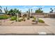 Attractive front yard with desert landscaping, native plants, and charming mailbox that enhances curb appeal at 2125 E Elmwood St, Mesa, AZ 85213
