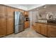 Spacious kitchen with stainless steel appliances, plenty of cabinets, and an open layout to the breakfast bar at 2125 E Elmwood St, Mesa, AZ 85213