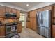 Functional kitchen with stainless steel appliances, granite countertops, and abundant cabinet space for convenient meal preparation at 2125 E Elmwood St, Mesa, AZ 85213