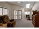 Inviting living room with vaulted ceiling, large windows and doors, plush seating, and abundant natural light at 2125 E Elmwood St, Mesa, AZ 85213