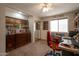Cozy home office with natural lighting, a large window, built-in storage, and carpeted floors at 2125 E Elmwood St, Mesa, AZ 85213