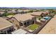 Aerial view of backyard of home with built-in pool, gazebo, and well manicured lawn at 21284 E Camacho Rd, Queen Creek, AZ 85142