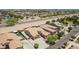 An aerial view of an upscale home and desert landscape with houses at 21284 E Camacho Rd, Queen Creek, AZ 85142