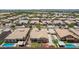 Expansive aerial view of a neighborhood showcasing uniform homes and a community landscape at 21284 E Camacho Rd, Queen Creek, AZ 85142