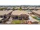 Aerial view of backyard of home with fire pit and well manicured lawn at 21284 E Camacho Rd, Queen Creek, AZ 85142