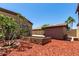 Backyard featuring a shed, block walls, and mature trees at 21284 E Camacho Rd, Queen Creek, AZ 85142