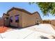 Backyard featuring block fencing and a view of the home's exterior at 21284 E Camacho Rd, Queen Creek, AZ 85142