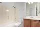 This bathroom features a shower and tub combination, a toilet, and vanity with a sink at 21284 E Camacho Rd, Queen Creek, AZ 85142