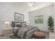 Comfortable bedroom featuring soft natural light, stylish decor and a modern ceiling fan at 21284 E Camacho Rd, Queen Creek, AZ 85142