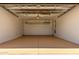 A two car garage features an epoxy floor, overhead storage, and access doors at 21284 E Camacho Rd, Queen Creek, AZ 85142