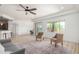 Open living space with hardwood flooring, abundant natural light, and neutral paint at 21284 E Camacho Rd, Queen Creek, AZ 85142