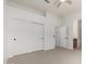 Spacious main bedroom features dual closets, ceiling fan, and neutral carpet flooring at 21284 E Camacho Rd, Queen Creek, AZ 85142