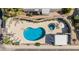 Aerial view of community pool with mature landscaping and lounge seating at 2233 E Behrend Dr # 162, Phoenix, AZ 85024