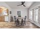 Dining area with wood flooring, neutral walls, artwork, and a window at 2233 E Behrend Dr # 162, Phoenix, AZ 85024
