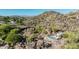 View of house with community pool, and surrounding rocky hillside landscape at 2233 E Behrend Dr # 162, Phoenix, AZ 85024