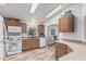 Charming kitchen with white appliances, wood cabinets, and wood look flooring at 2233 E Behrend Dr # 162, Phoenix, AZ 85024