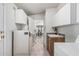 Functional laundry room with tile flooring, white cabinets, sink, and appliances at 2233 E Behrend Dr # 162, Phoenix, AZ 85024